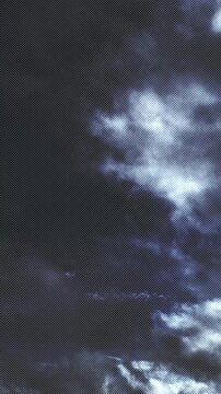 Aerial Hyperlapse of dark stormy clouds over a deep blue sky. Vertical 2k perfect for social media campaigns and sky replacements