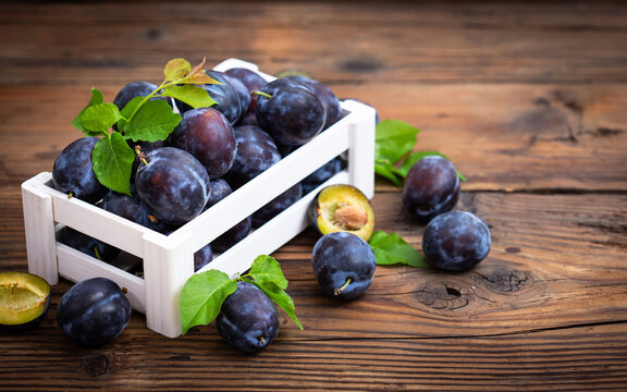 Fresh organic plums in the crate	