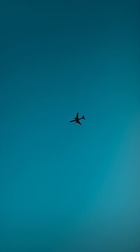 Airplane flying in clear sky.