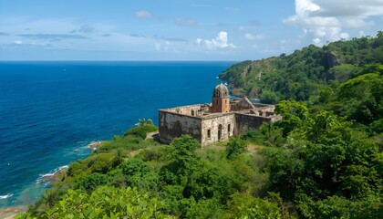 Fototapeta premium The historic ruins of Chateau Dubuc on the scenic Caravelle Peninsula in Martinique surrounded by lush green nature and the blue ocean