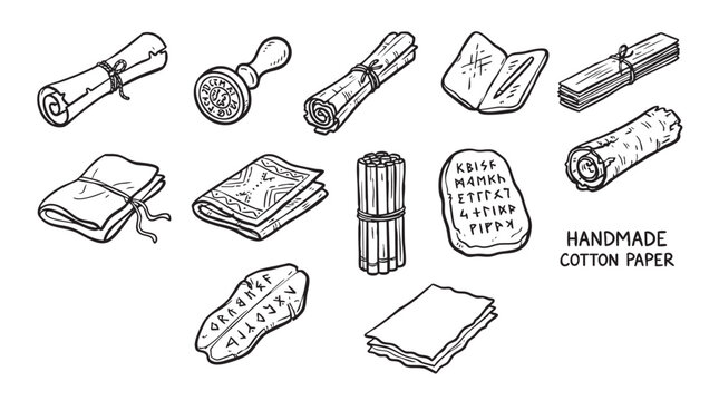 Ancient writing materials set with scrolls handmade cotton paper and stone tablets.