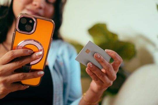 Person doing online payment with digital device and credit card
