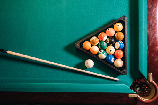 Billiard table with green surface and balls in the billiard club.Pool Game