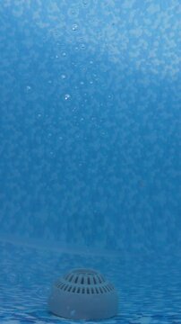Swimming pool main drain bubbling underwater