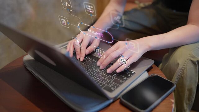 Close-up of a person using a laptop with a digital AI agent interface overlay for productivity, software development, and automation concepts.