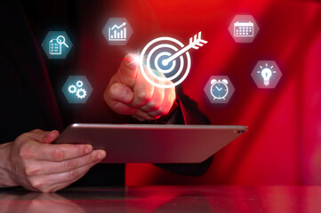 Business professional tracking objectives, milestones and project performance using digital target dashboard and workflow management interface. © svetazi