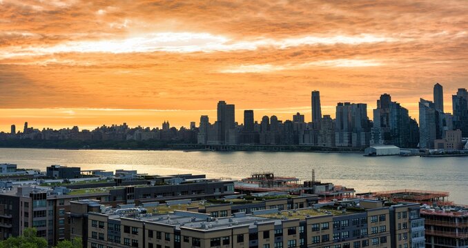 Manhattan Skyline and Hudson River at Dramatic Orange Sunrise