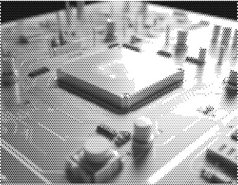 Digital electronic data system network hardware motherboard chip cpu processor circuit displaying monochrome black white dotted pattern texture.