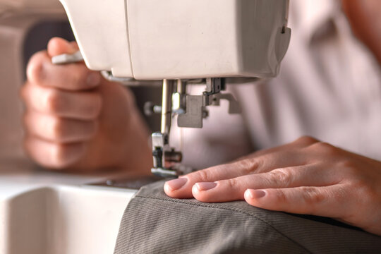 Upcycling clothing, woman repairing and altering garment at home, second life fashion, slow fashion, zero waste sewing, mending, sustainable lifestyle and conscious consumption