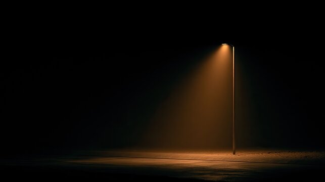 Solitary streetlight illuminates a dark, moody, atmospheric scene