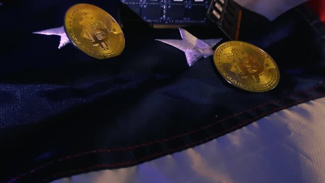 Macro shot gliding over physical bitcoin coins and computer RAM memory sticks with artificial intelligence logos, all resting on a waving American flag symbolizing the nation's economy