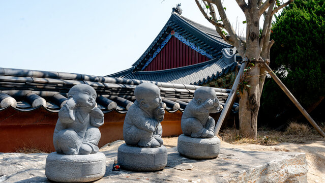 Three wise Buddha statues at Haeundae Yonggungsa Temple