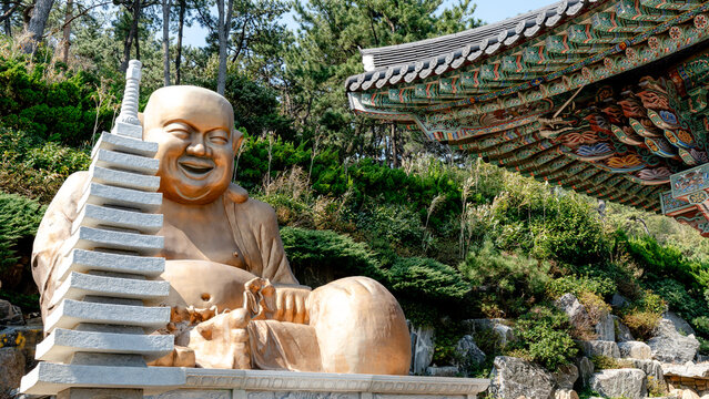 Golden statue of Budai at Haeundae Yonggungsa Temple