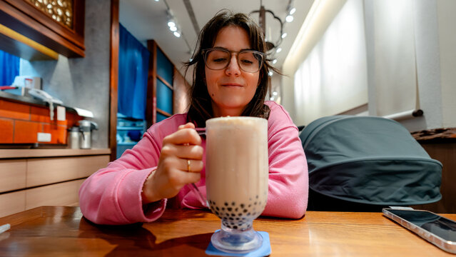 Enjoying bubble tea in a cozy taiwan cafe
