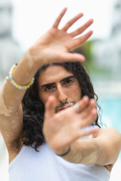 Middle Eastern man with vitiligo posing outdoors portrait