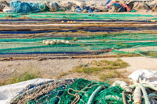 Fishing nets drying on a Calpe harbor quay in Spain