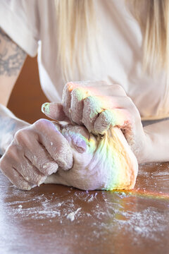 Close-up of hands kneading homemade sourdough bread dough