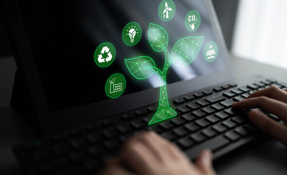 Digital Connection Between Technology and Nature with Green Icons Representing Sustainability on a Laptop Screen Quark.