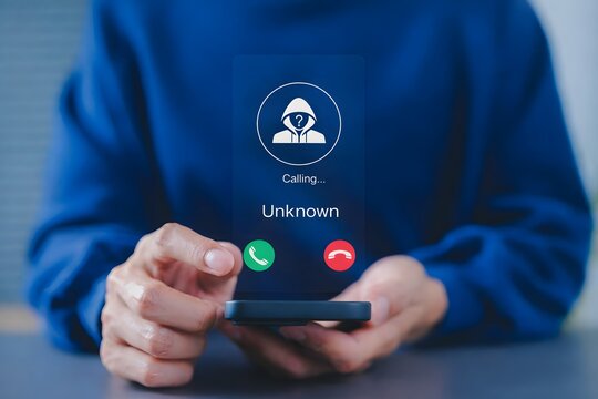 Fraud and phishing concept. Man holding mobile phone with incoming call from unknown caller. scammer or stranger, Hoax person with fake identity, Prank caller, anonymous, smartphone, unwanted, spam,