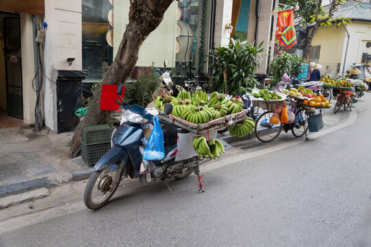Street vendors selling fresh fruits in Hanoi city