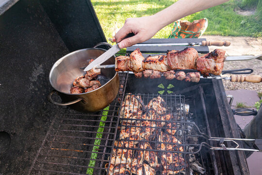 Summer barbecue grilling marinated meat on outdoor grill