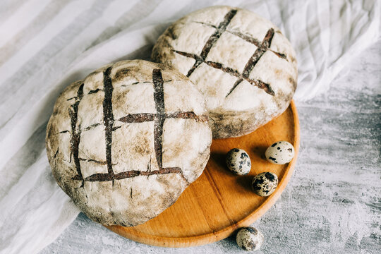 Rustic artisan bread with organic ingredients on board