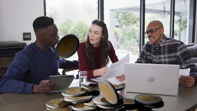 Family group reviewing finances, animation starting releasing coins onto table while group watching