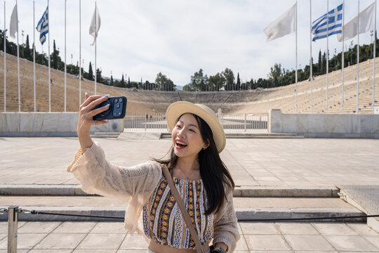 Tourist taking selfie at Athens Panathenaic Stadium