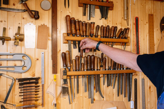 Man selecting tools in a woodworking shop in Spain