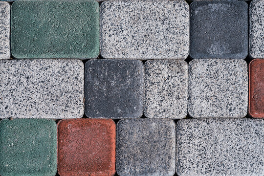 Close-up of colorful granite cobblestone pavement texture