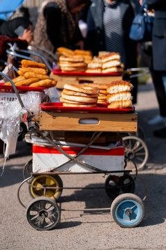 Street vendor cart with stacked bagel and pastry in market