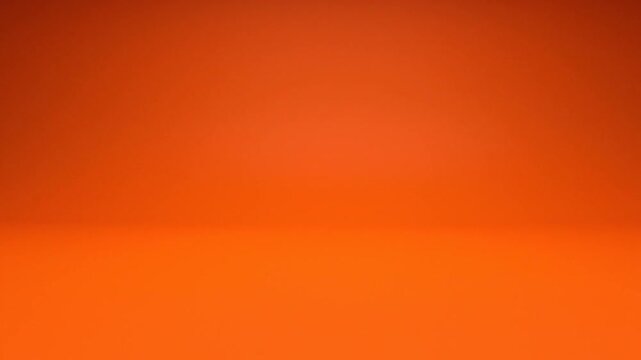 Vibrant orange gradient studio background with horizontal floor line