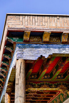 Ancient Bukhara wooden eaves with colorful painted ornament