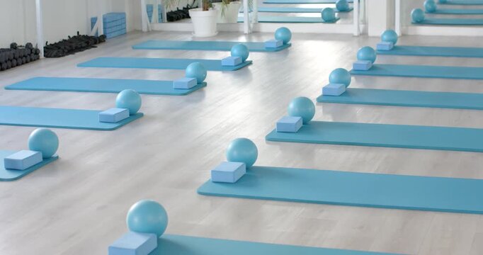 Clip start is starting camera panning right, showing turquoise mats, blocks and balls set for class
