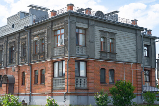 Historic brick and wooden apartment building facade view