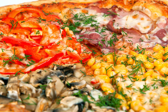 A closeups shot of baked four seasons pizza toppings with mushrooms ham sweet corn and red bell peppers. Italian fast food, macro cheesy pastry, savory dinner dish meal. Dining.