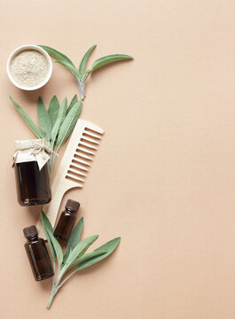 Sustainable haircare template with unbranded amber dropper vials, ayurvedic ubtan powder and a massage comb