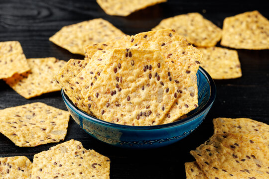 Seeded Tortilla Crackers in a Blue Bowl