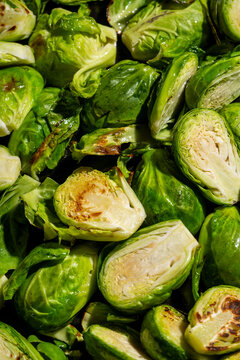 Closeup of roasted Brussels sprouts with green leaves