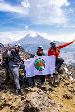 Group of hikers celebrating on mountain summit