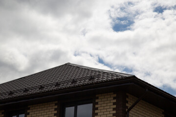 Obraz premium Metal tile.Roof for the house. Modern coatings for the roof of the house.