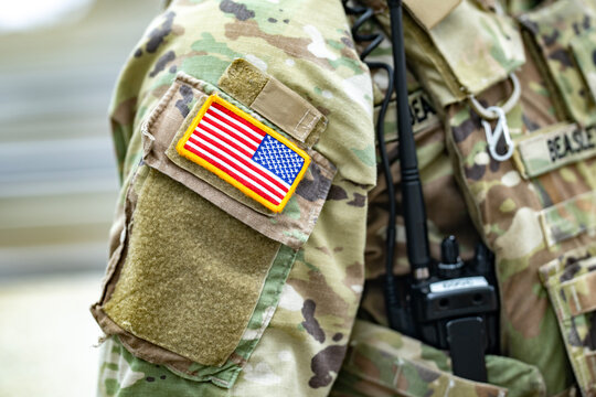 Washington DC. USA. National Guard. American flag patch on camouflage uniform. American flag beside military radio. American flag on soldier gear. American flag closeup on army sleeve.