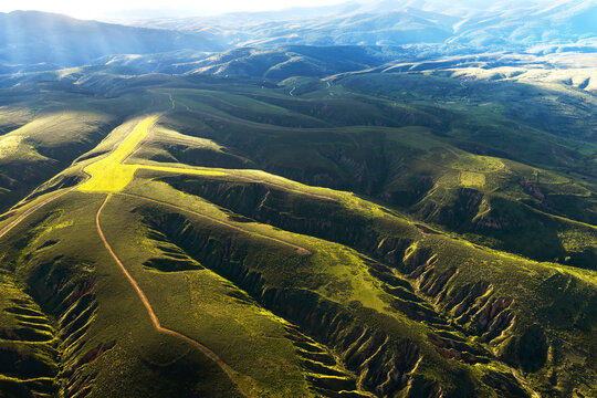 Rolling green hills and valleys near Guadalajara at sunrise