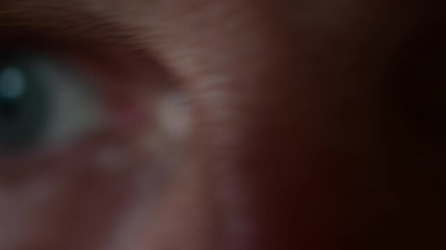 Macro close up cinematic off focus bokeh video, abstract artistic, emotion, human body, vivid men blue eye's 