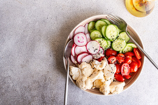 Fresh vegetable salad with cauliflower and radish slices
