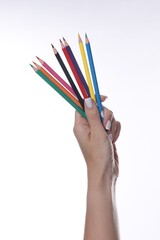 Naklejka premium Woman with colorful pencils on white background, closeup