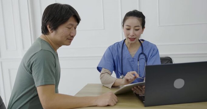 Closeup asian mature man at the doctor's clinic. Asian doctor woman with hand holding pen examining checking checkup list paper . Healthcare and medical sickness concept 