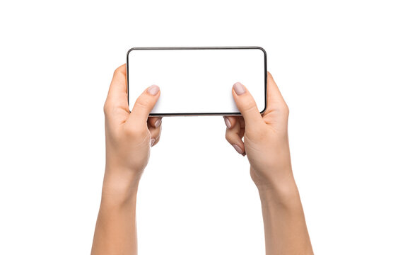 Woman's hands holding smartphone with blank screen in horizontal orientation and playing video games