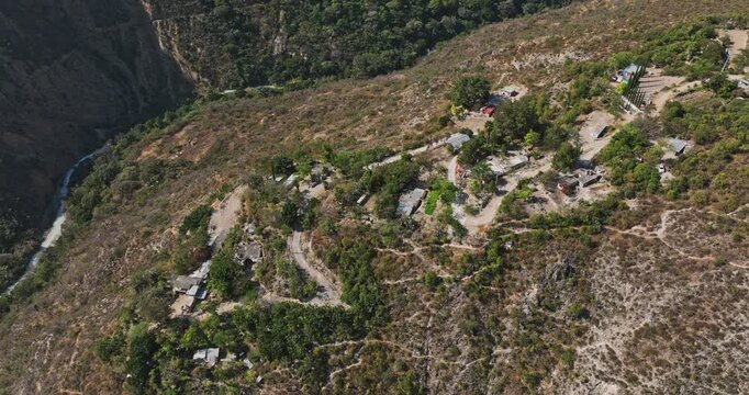 Tolantongo Mexico Aerial v10 birds eye view fly around mountaintop community area, capturing canyon and mountain slopes, tilt up reveals beautiful landscape - Shot with Mavic 3 Cine - December 2021