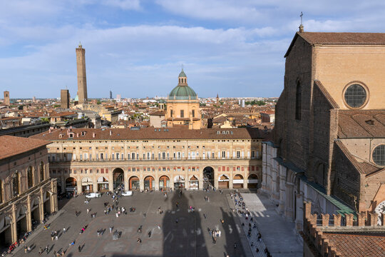 Aerial view of Bologna old town, Emilia Romagna, Italy with Palazzo dei Banchi with arched porticoes and Dome of the Basilica of San Pietro at sunrise. Travel destination in Europe